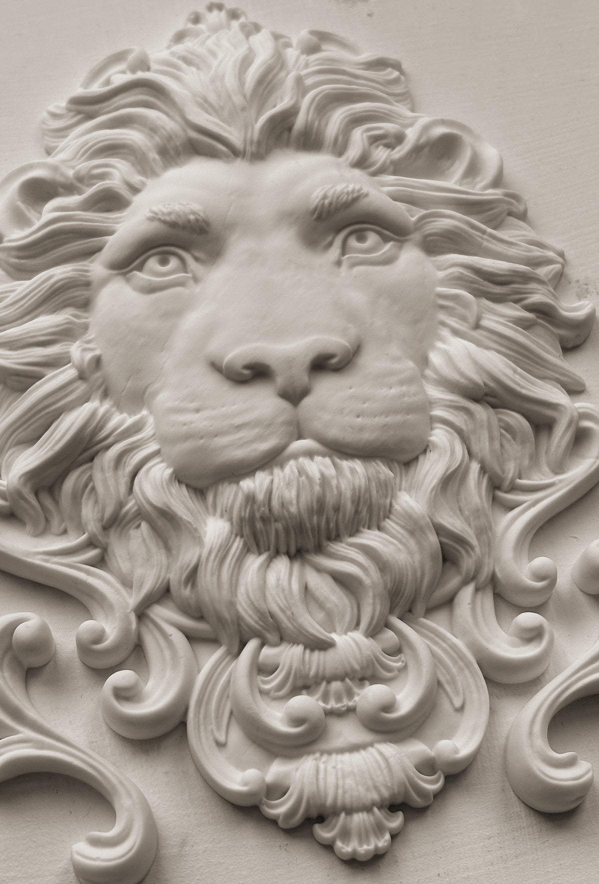 White clay casting of the lion's head from Iron Orchid Designs Leonidas mould.