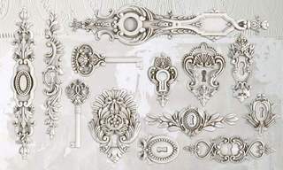 Iron Orchid Designs Lock and key grey silicone Mould castings made from white clay on a white background