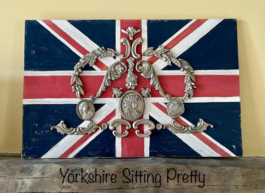 Union Jack plaque hand painted and decorated with gold castings positioned in the shape of a crown