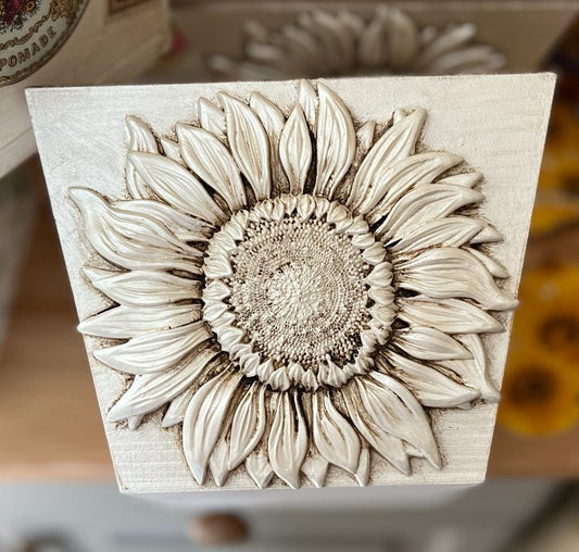 White square shaped plant pot with big white sunflower casting on the front which has been aged with brown wax