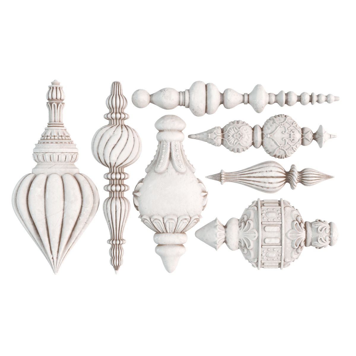 A set of ornate white decorative finials and trim pieces arranged on a plain white background, including pointed, ribbed, fluted, and carved architectural hardware styles. Baubles mould by Iron Orchid Designs.