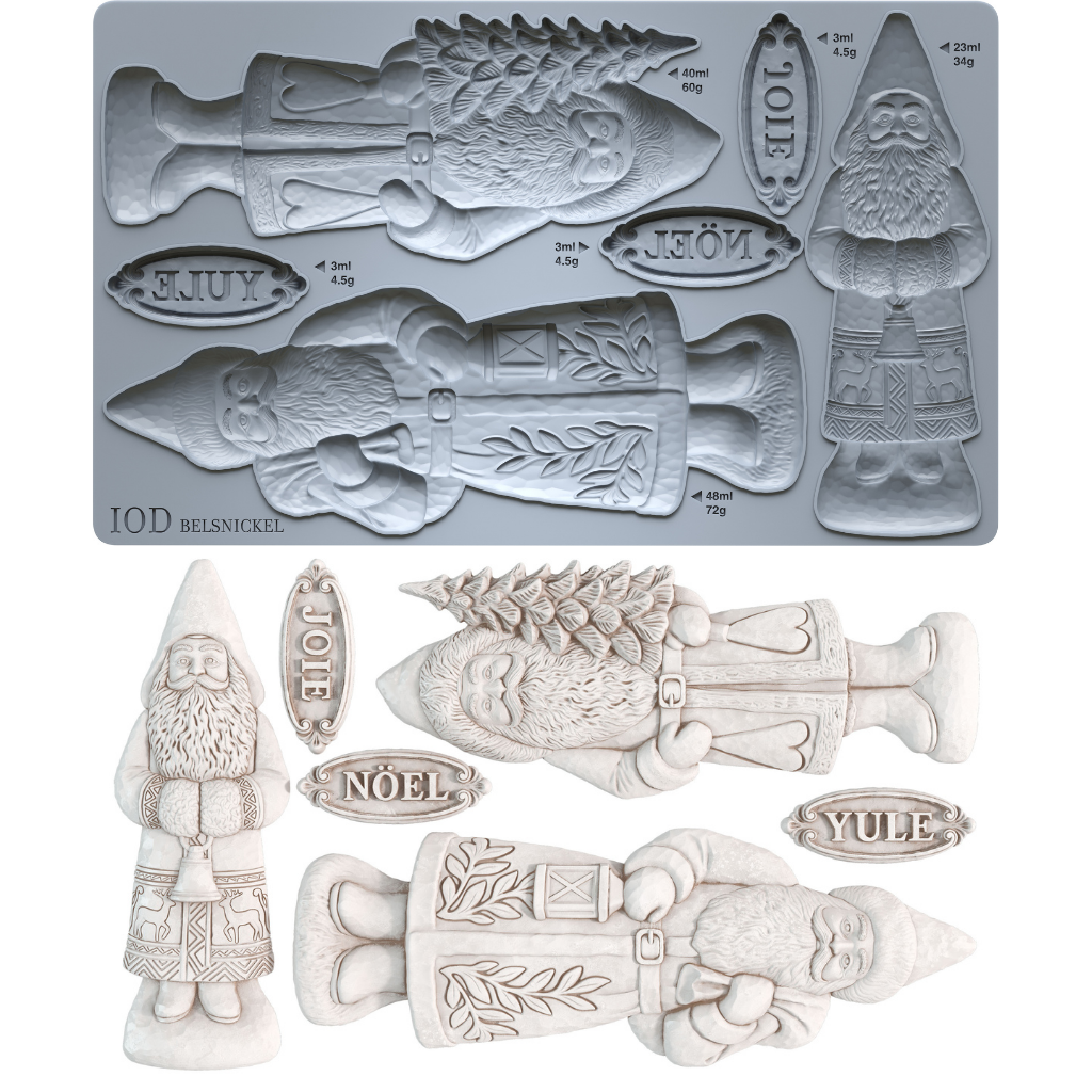 A mold tray and example castings for IOD Belsnickel Christmas ornaments, featuring a fish, gnome, Saint Nick, and holiday words like Joie, Noël, and Yule in a light gray and off-white color scheme.From Iron Orchid Designs.