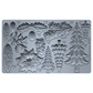 A gray silicone baking or craft mold tray with multiple embossed holiday botanical and tree shapes, including pinecones, holly leaves, mistletoe, and Christmas trees, each labeled with volume and weight measurements. Boughs of Holly Iron Orchid Designs