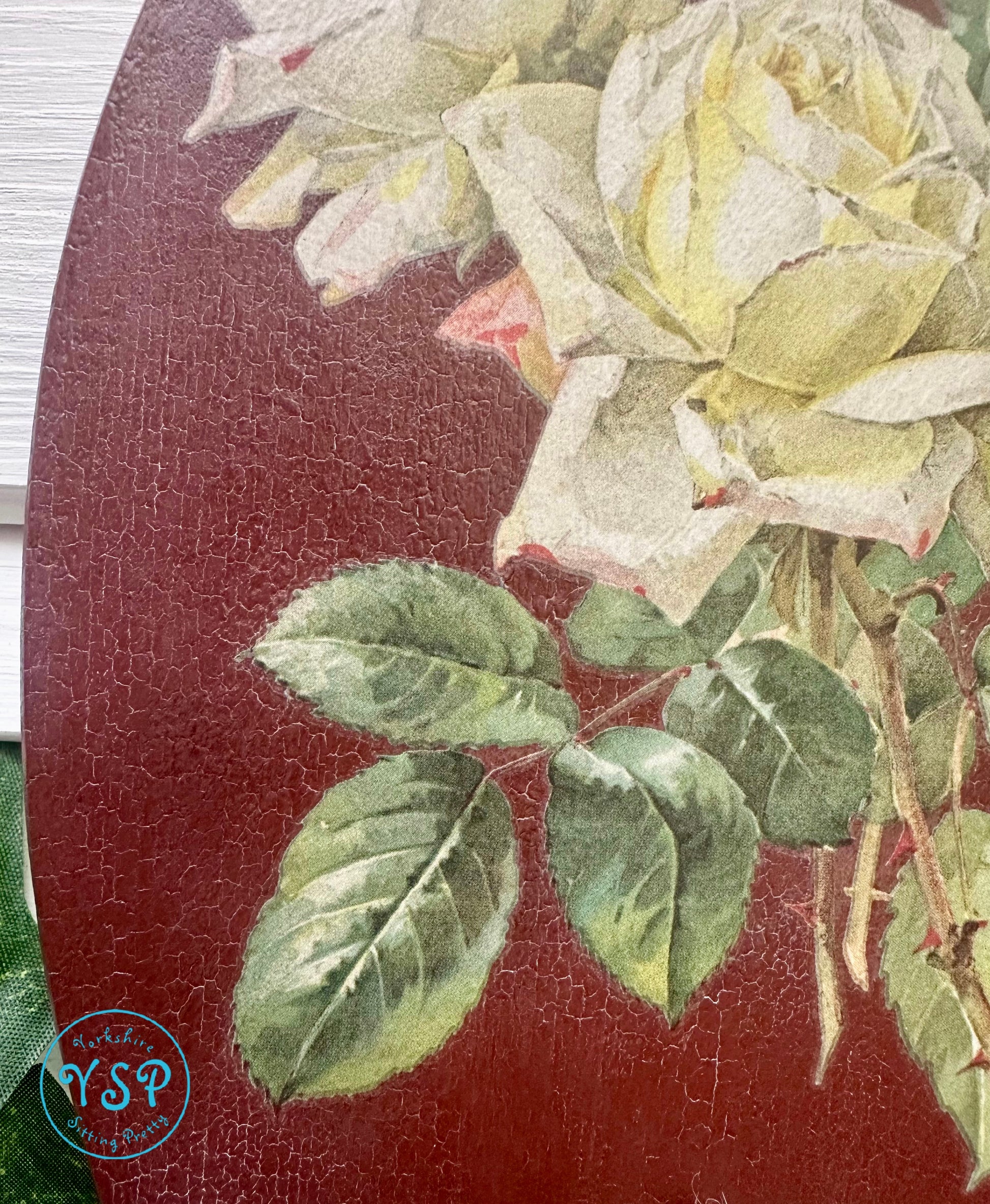 Close up image of crackle effect on hnad painted floral hanger/hook