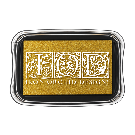 Iron Orchid Designs gold foil stamp with a black ink pad and silver metal frame, featuring a white ornate gothic letter 'F' and the brand name 'IRON ORCHID DESIGNS'.
