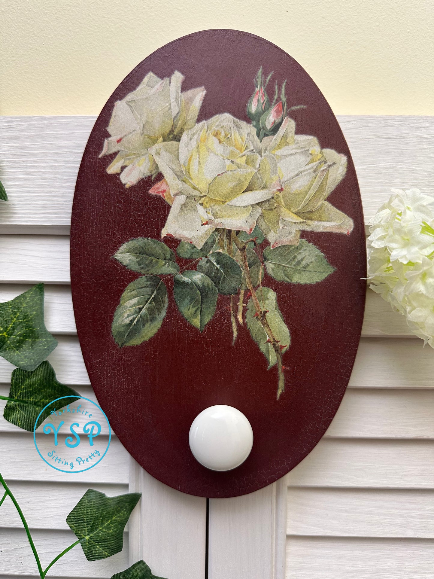 Hand painted floral wall hanger/hook on a white background