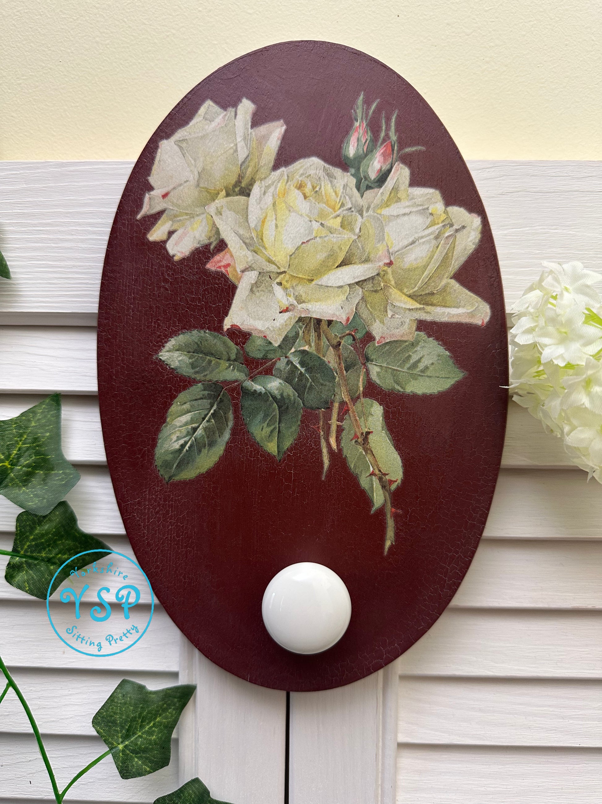 Hand painted floral wall hanger/hook on a white background