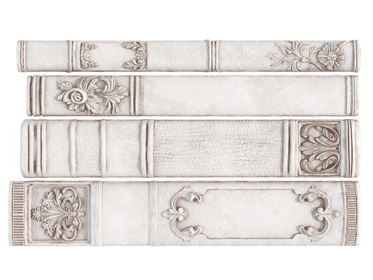 Decorative bookends with intricate designs on a white background from Iron Orchid Designs Bookish Mould