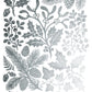 A sheet of silver metallic foil stamps featuring various winter botanical designs, including mistletoe, holly leaves, pine branches, acorns, and ivy, arranged on a white background. From Iron Orchid Designs