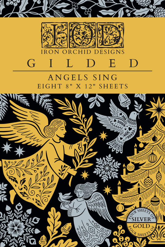 Cover of the Iron Orchid Designs 'Gilded' sheet set, featuring a gold and black background with silver-gray illustrations of angels, a Christmas tree, and snowflakes. Text indicates eight 8" x 12" sheets.