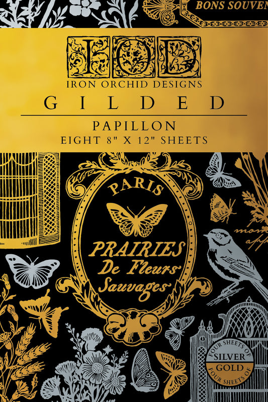 Gilded Papillon Transfer from Iron Orchid Designs paper pack with gold and silver floral and butterfly designs on a black background