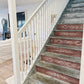 Iron Orchid Designs Tromp l'oeil Laurel Paint Inlay used on the risers of dark wood stairs with a light coloured staircase