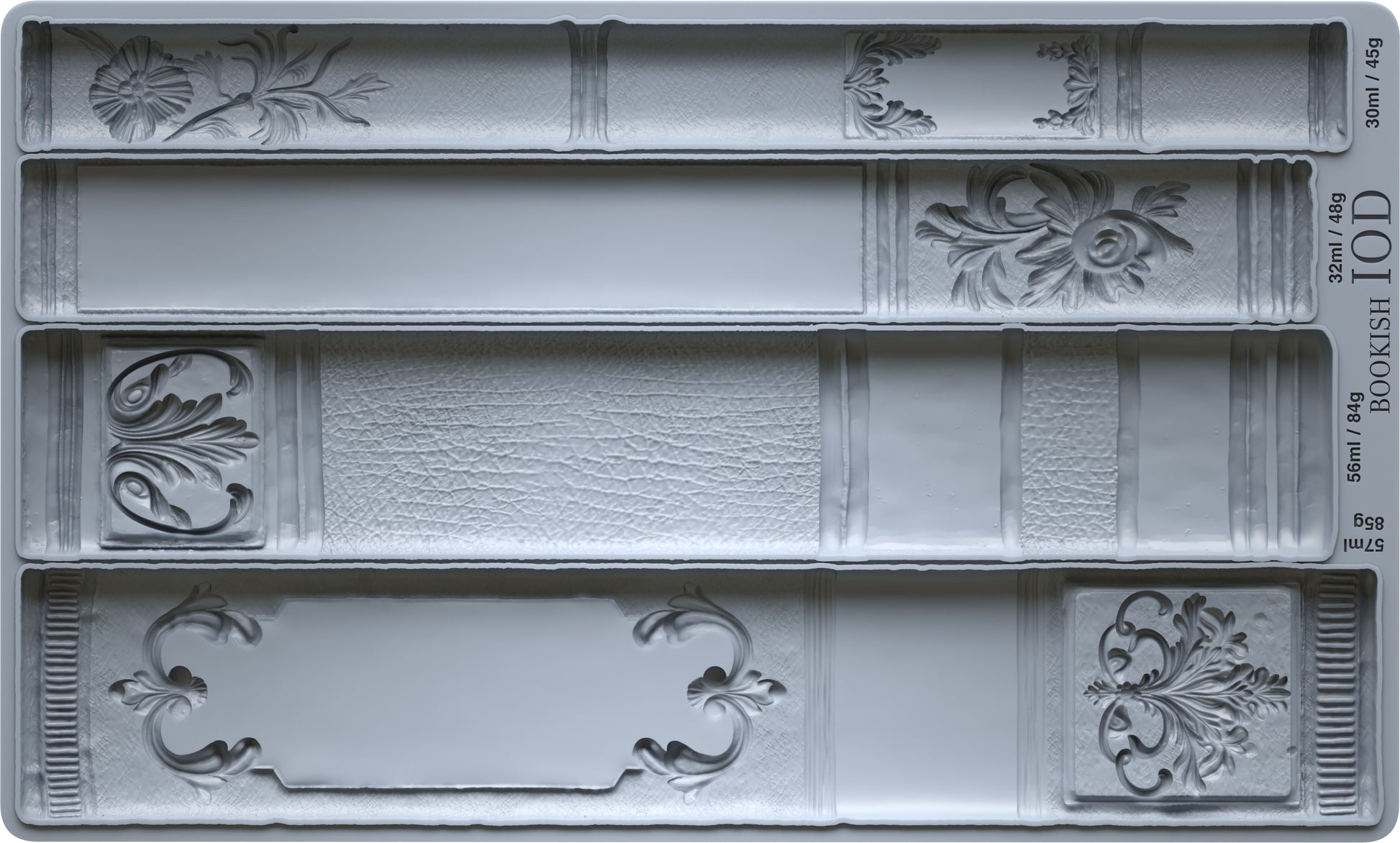 Decorative silicone Bookish mould from Iron Orchid designs with bookshelf design patterns on a grey background