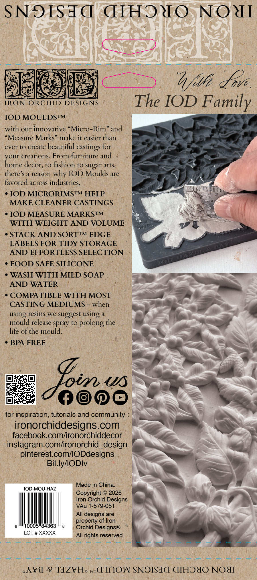 Back of a IOD Moulds 'With Love, The IOD Family' Iron Orchid Designs castings kit box, featuring product information, barcode, and a close-up photo of a hand holding a cast silicone mold. Hazel and Bay mould.