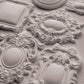 Decorative white clay castings with intricate designs on a light grey background from Iron Orchid Designs Frames 3 Mould