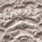 Close-up of ornate decorative stucco work with cherubs and shell designs from Iron Orchid Designs Cadre Mould