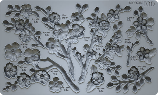 An Iron Orchid Designs resin mould featuring a design of cherry blossoms in various stages of bloom, intended for crafting and furniture embellishment.