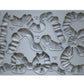 A grey silicone decor mould by Iron Orchid Designs featuring various bow shapes for crafting and baking