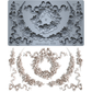 Decorative mould from Iron Orchid Designs with wreath and swag designs and matching decorative elements on a white background.