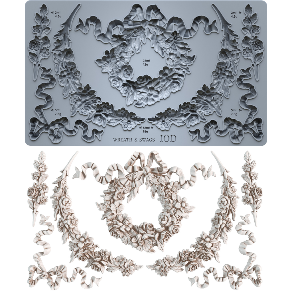 Decorative mould from Iron Orchid Designs with wreath and swag designs and matching decorative elements on a white background.