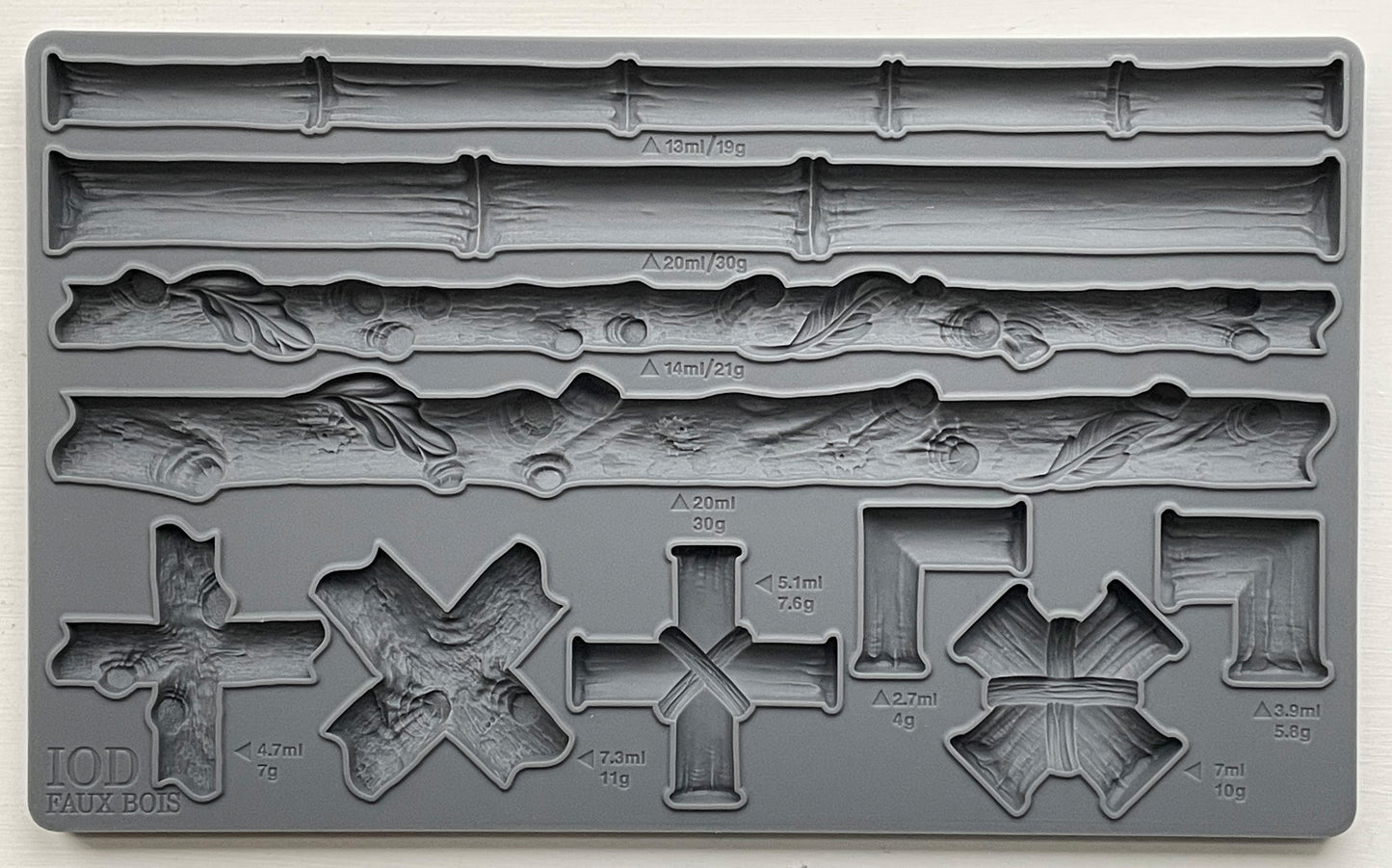 A grey silicone craft mould from Iron Orchid Designs featuring various bamboo and faux bois designs for furniture appliques and moulds.