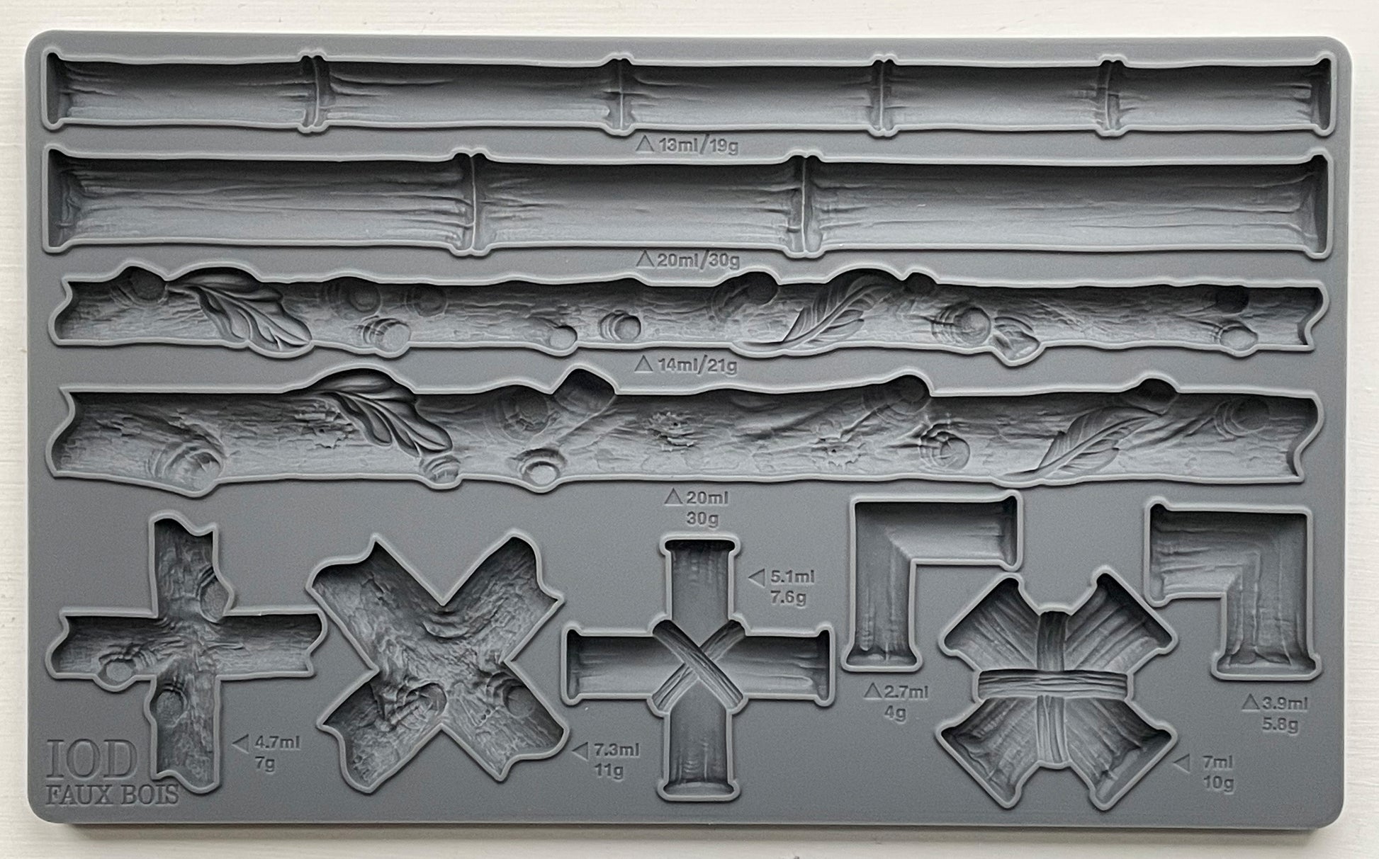 A grey silicone craft mould from Iron Orchid Designs featuring various bamboo and faux bois designs for furniture appliques and moulds.