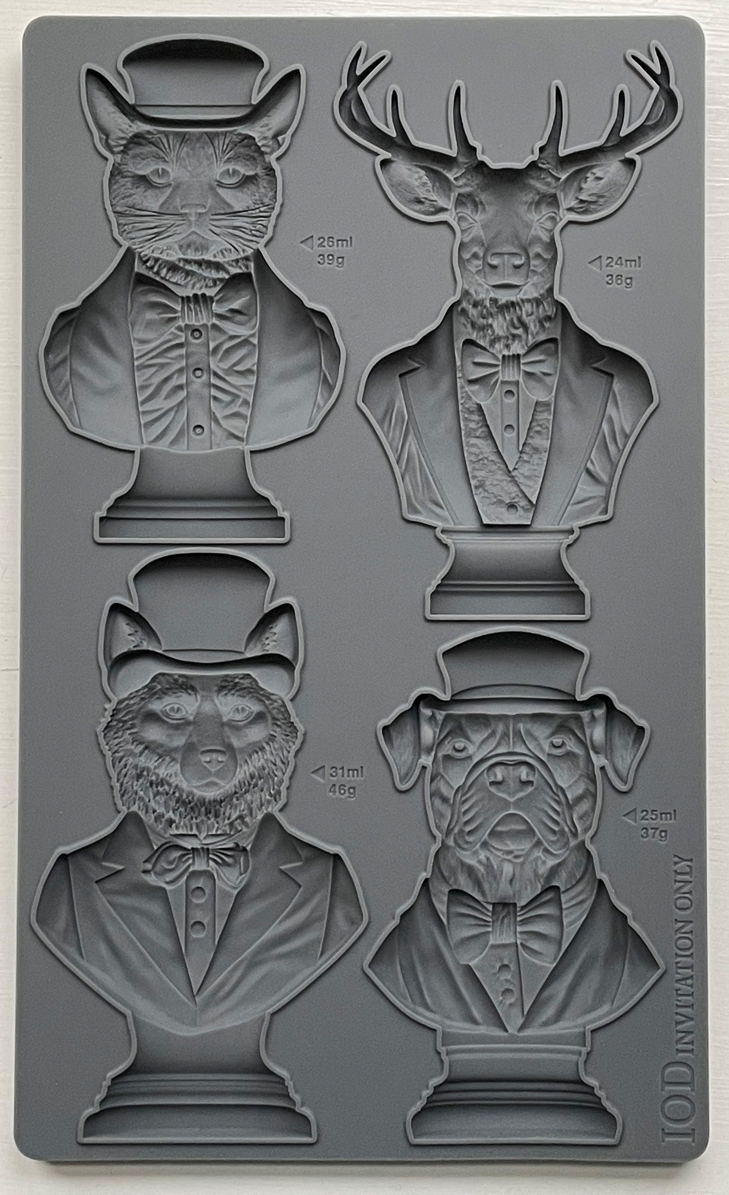 A set of four animal bust molds, including a cat, dog, stag, and fox, each wearing a hat and bow tie, from Iron Orchid Designs.