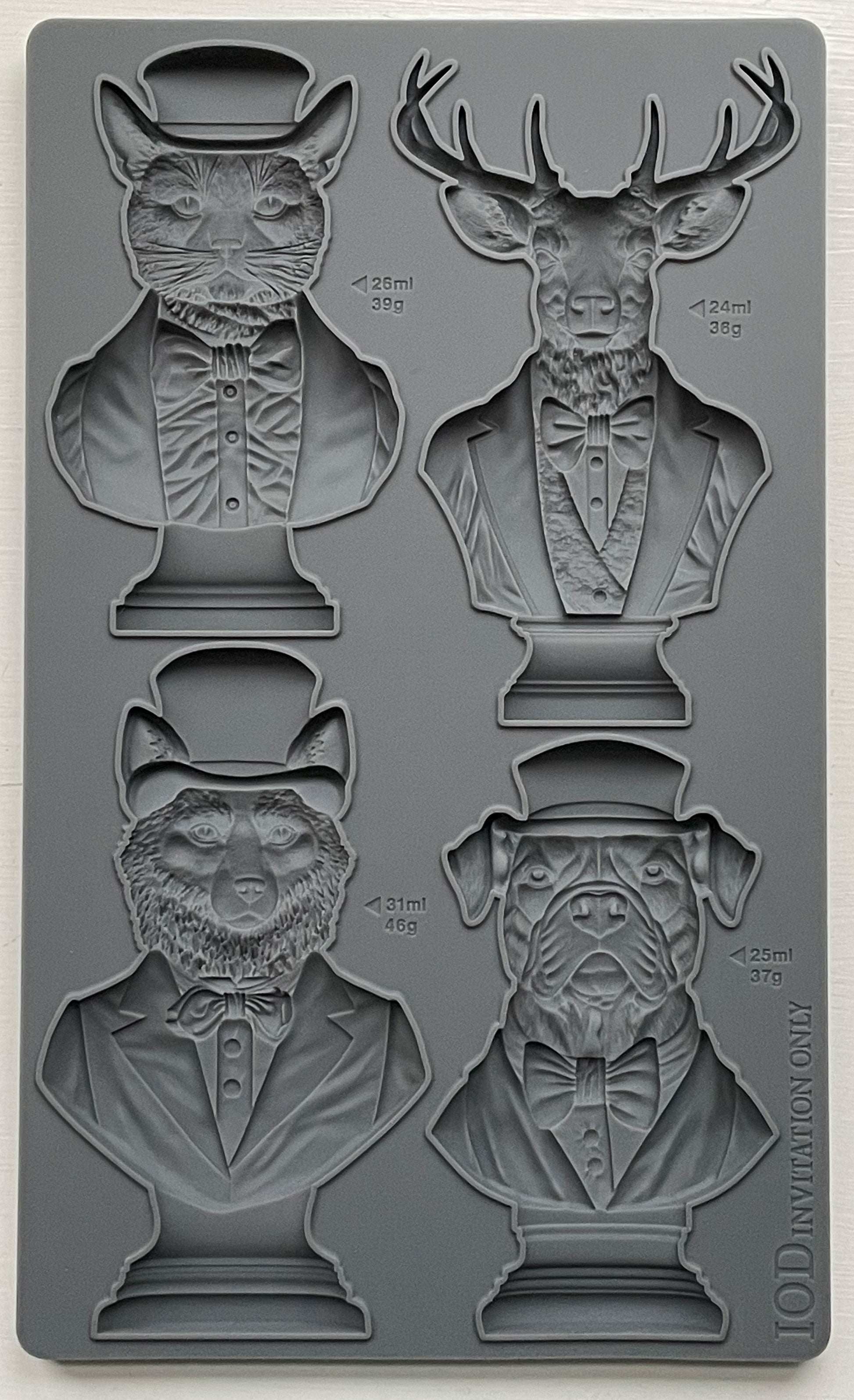 A set of four animal bust molds, including a cat, dog, stag, and fox, each wearing a hat and bow tie, from Iron Orchid Designs.