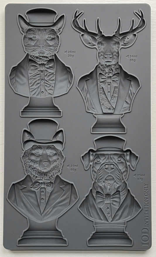A set of four animal bust molds, including a cat, dog, stag, and fox, each wearing a hat and bow tie, from Iron Orchid Designs.