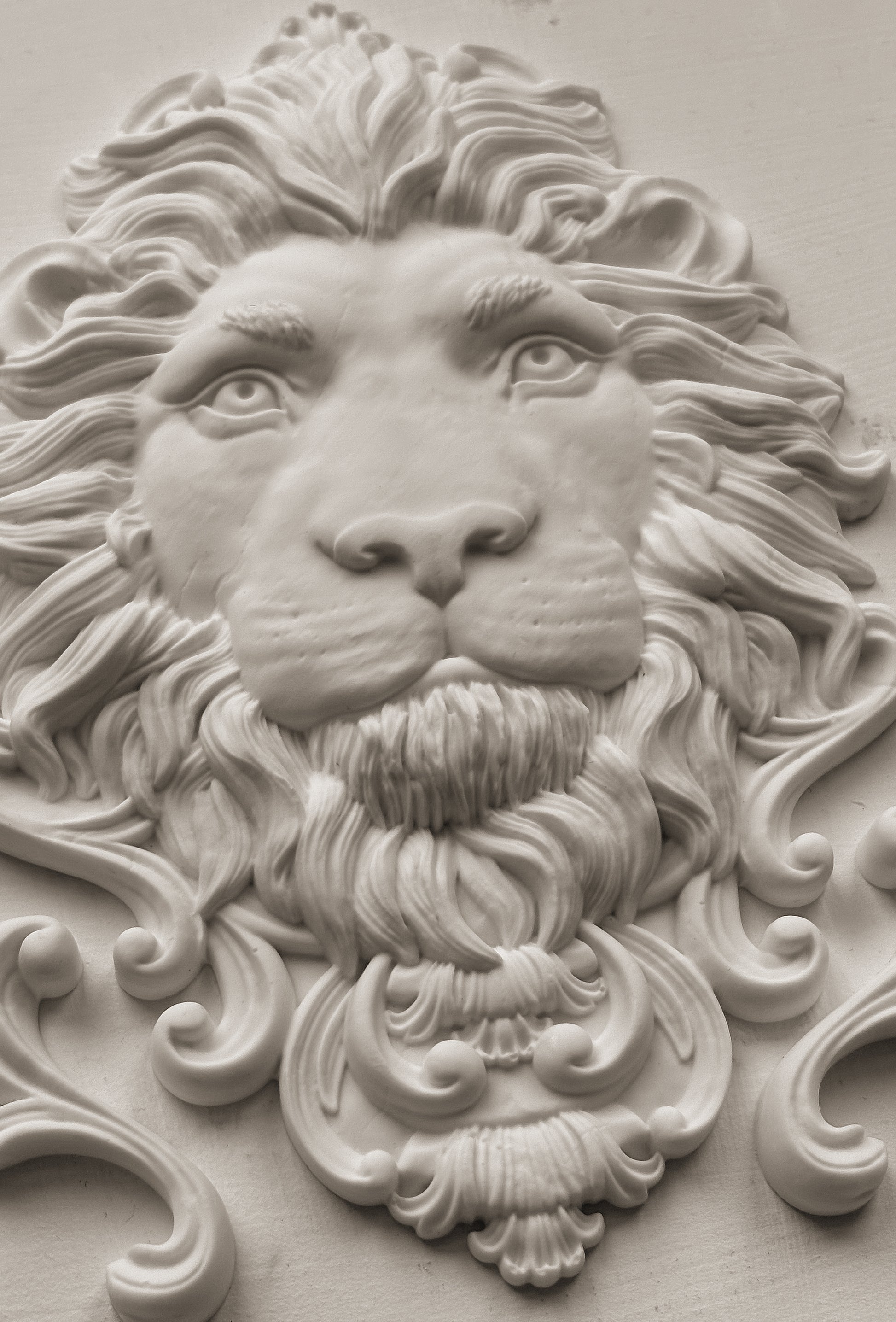 White clay casting of the lion's head from Iron Orchid Designs Leonidas mould.