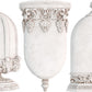 White castings of Iron Orchid Designs Les Cloches mould. Three intricately designed castings in white clay on a white background