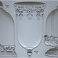 A set of three decorative bell-shaped moulds with intricate detailing, labeled as 'Les Cloches' from Iron Orchid Designs.