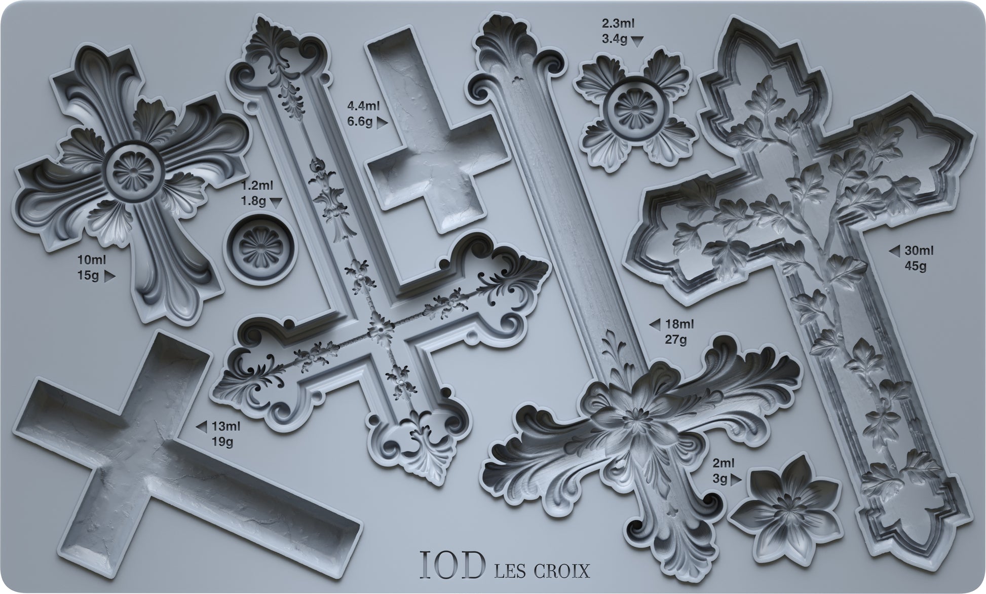 A grey silicone mould from Iron Orchid Designs featuring a collection of nine decorative crosses.