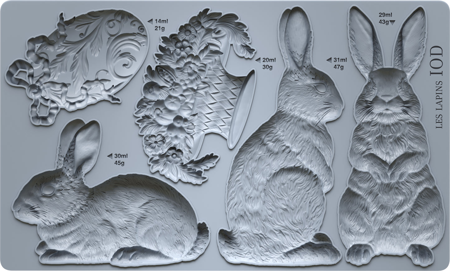 Grey silicone mould from Iron Orchid Designs. Les Lapins has three rabbits, a basket and an decorative egg.