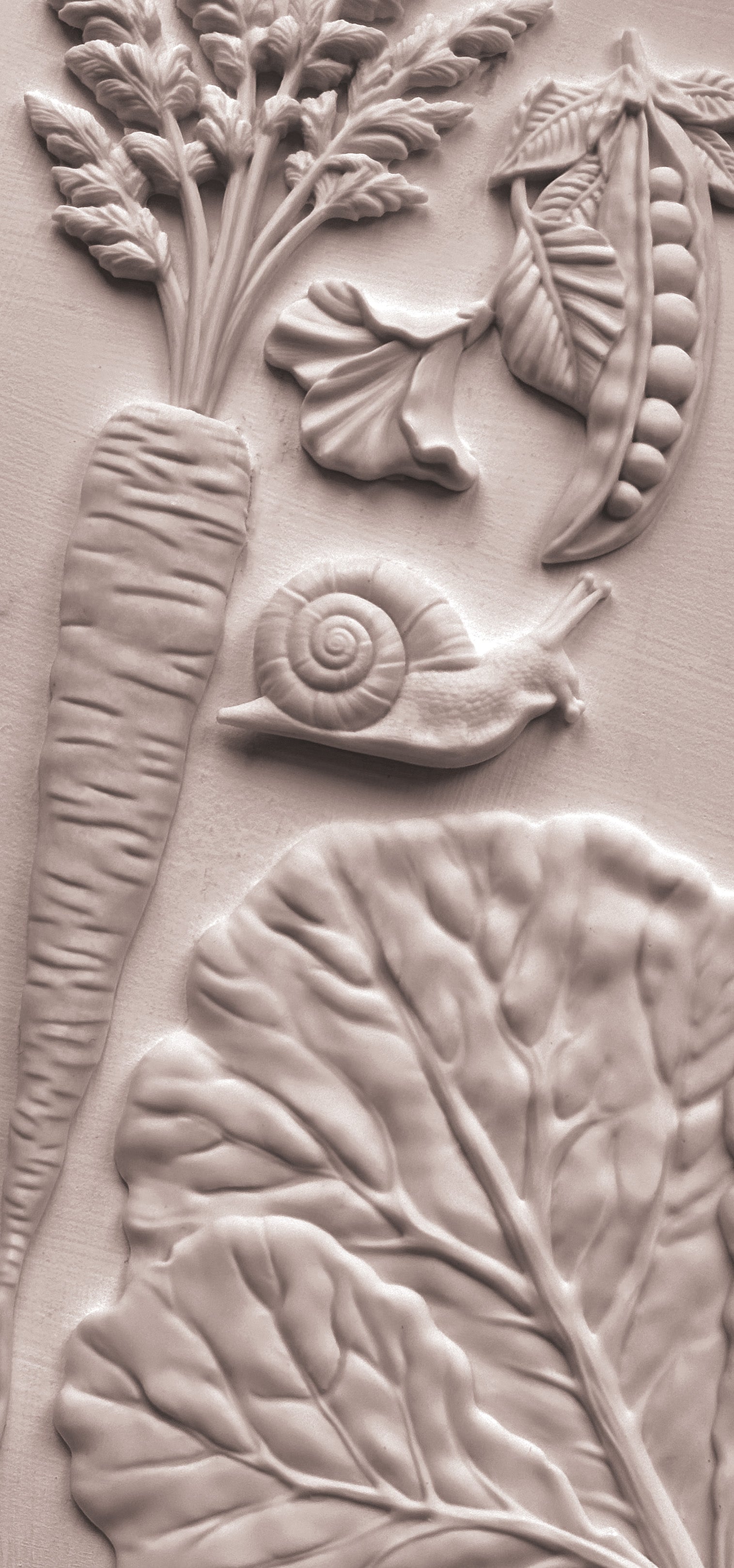 Close up of white castings from Iron Orchid Designs Spring Garden Mould on a white background