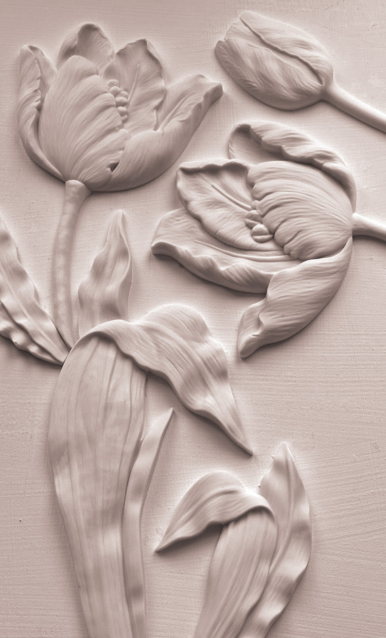 A close up view of white castings on a white background from Iron Orchid Designs Tulips mould