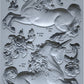 An Iron Orchid Designs mould featuring a series of unicorn figures in various poses with floral elements, designed for crafting and embellishment.