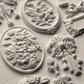 White clay castings from Iron Orchid Designs Victoriana mould on a white background