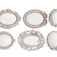 All six white clay castings from Iron Orchid Designs Vintage Brooches mould on a white background