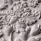 A close up image of white clay castings from Iron Orchid Designs Wild Berries mould.