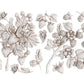 White clay castings from Iron Orchid Designs Wild Berries mould. The white castings are of strawberries, leaves and flowers on a white background.