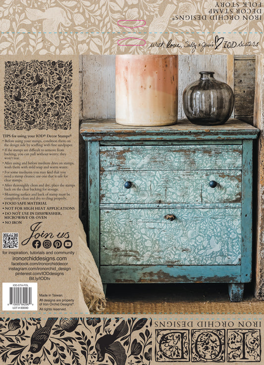 Decorative distressed dresser with candles and a vase, featuring Iron Orchid Designs products.