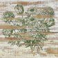 A stamped image of a floral bouquet using green ink and iron Orchid Designs Garden Bouquet Stamp. The image has been distressed and stamped onto a white planked background