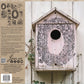 Decorative birdhouse with floral design on a wooden background, featuring IOD  Nature's Etchings stamp.
