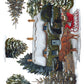 A watercolor-style winter village scene with snow-covered evergreen trees, a small cottage, and a red sleigh drawn by a brown horse on a white background. From Iron Orchid Designs.