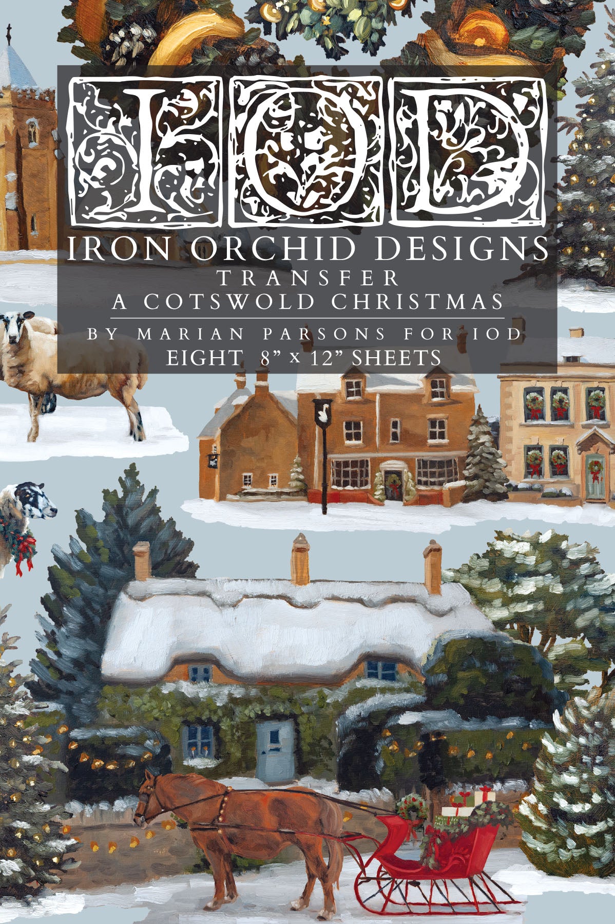 Cover art for 'Iron Orchid Designs Transfer: A Cotswold Christmas' by Marian Parsons, showing a snowy village scene with a horse-drawn sleigh, cottages, trees, and a large decorative title block at the top.