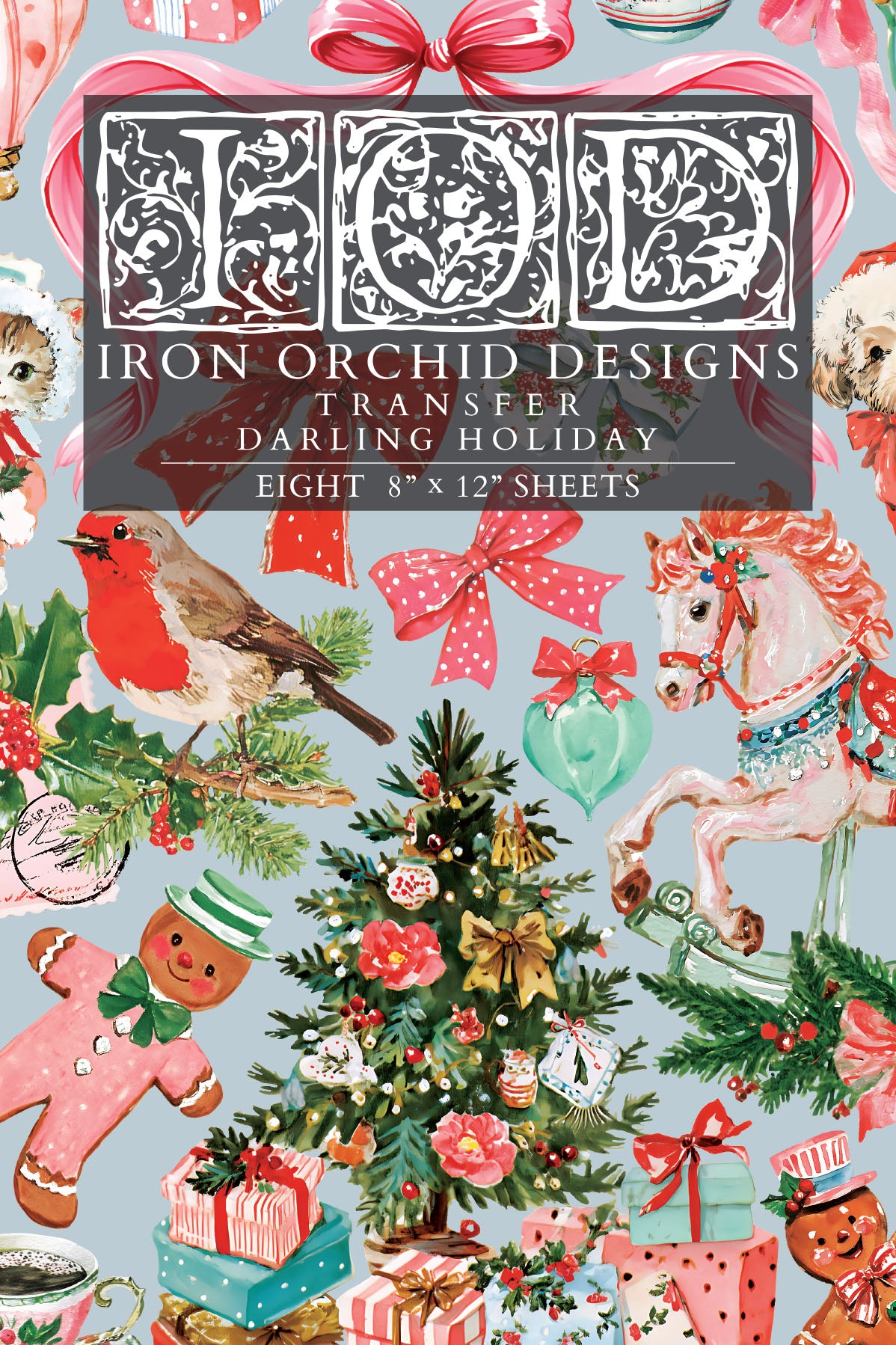 A Christmas-themed retro transfer paper sheet featuring a busy holiday pattern with a robin, carousel horse, ornaments, gifts, gingerbread men, bows, and a central title panel reading 'Iron Orchid Designs Transfer Darling Holiday' and 'Eight 8" x 12" sheets'. From Iron Orchid Designs.
