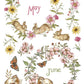 A watercolor-style botanical collage with rabbits, flowers, leaves, butterflies, and the words 'May' and 'June' on a white background. From Iron Orchid Designs