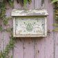 Decorative letterbox on a weathered wooden wall with greenery from Iron Orchid Designs Fern Fables transfer