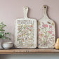 Decorative cutting boards with floral designs on a shelf against a light pink  wall from Iron Orchid Designs Primrose Isle Transfer